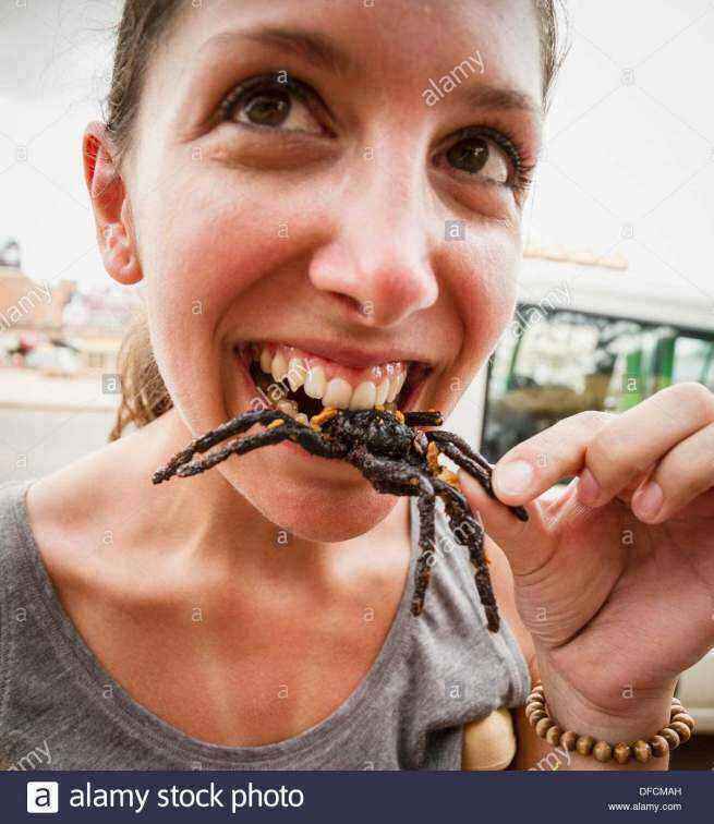 cambodia-young-woman-eating-fried-tarantula-spiders-DFCMAH.thumb.jpg.b6aa058926e3f2f7798093f7fdb2e377.jpg